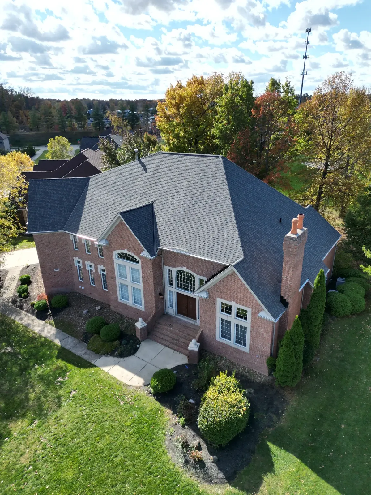 Aerial view of a new architectural shingle roof installation in an Avon, Ohio neighborhood