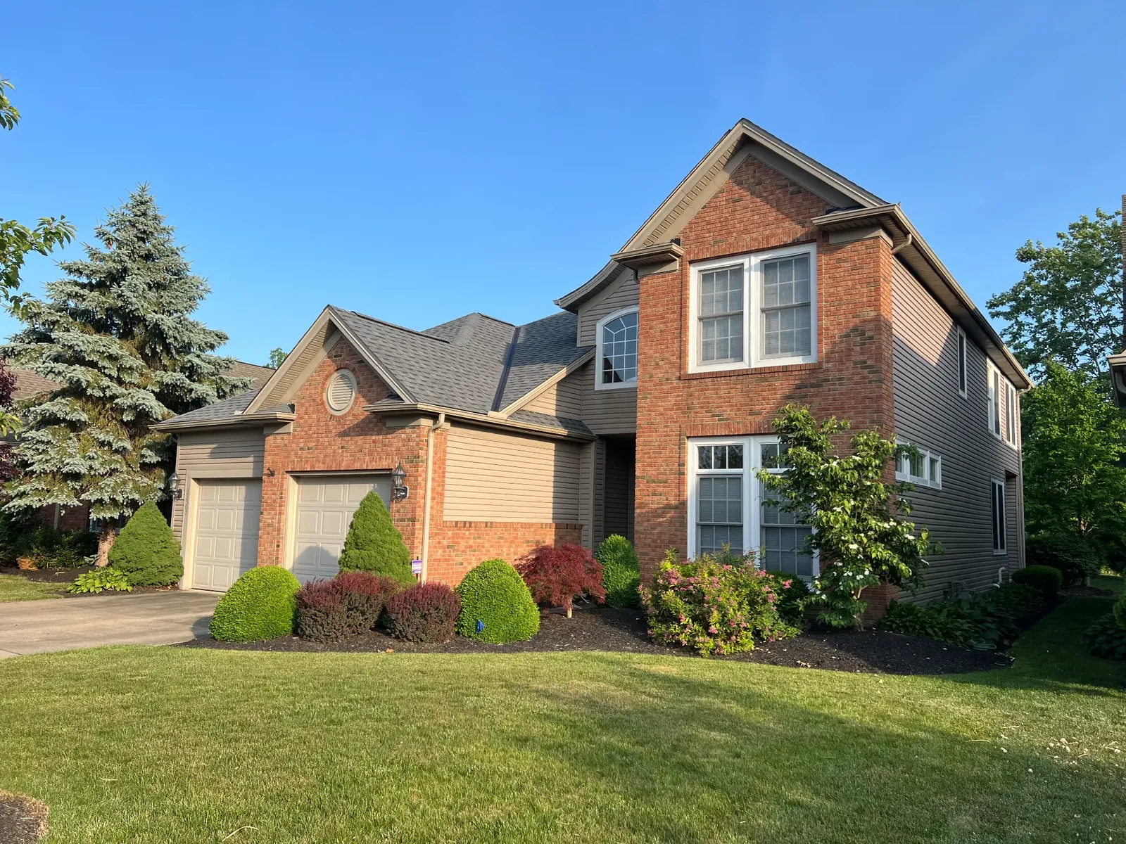 Shingle roof repaired after wind damage on a home in Avon, Ohio