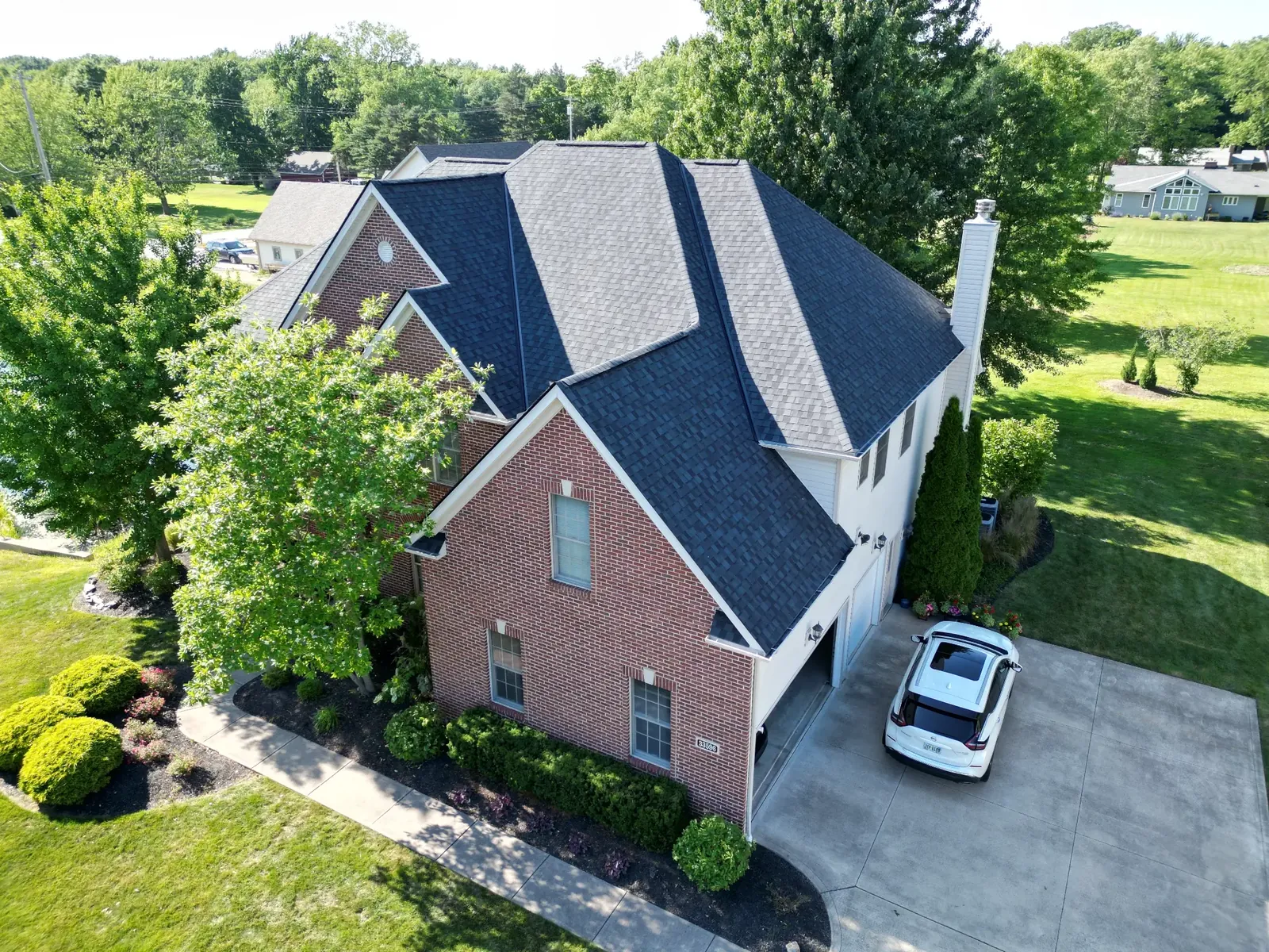 Aerial view of an asphalt shingle roof replacement in the Red Tail neighborhood of Avon, Ohio