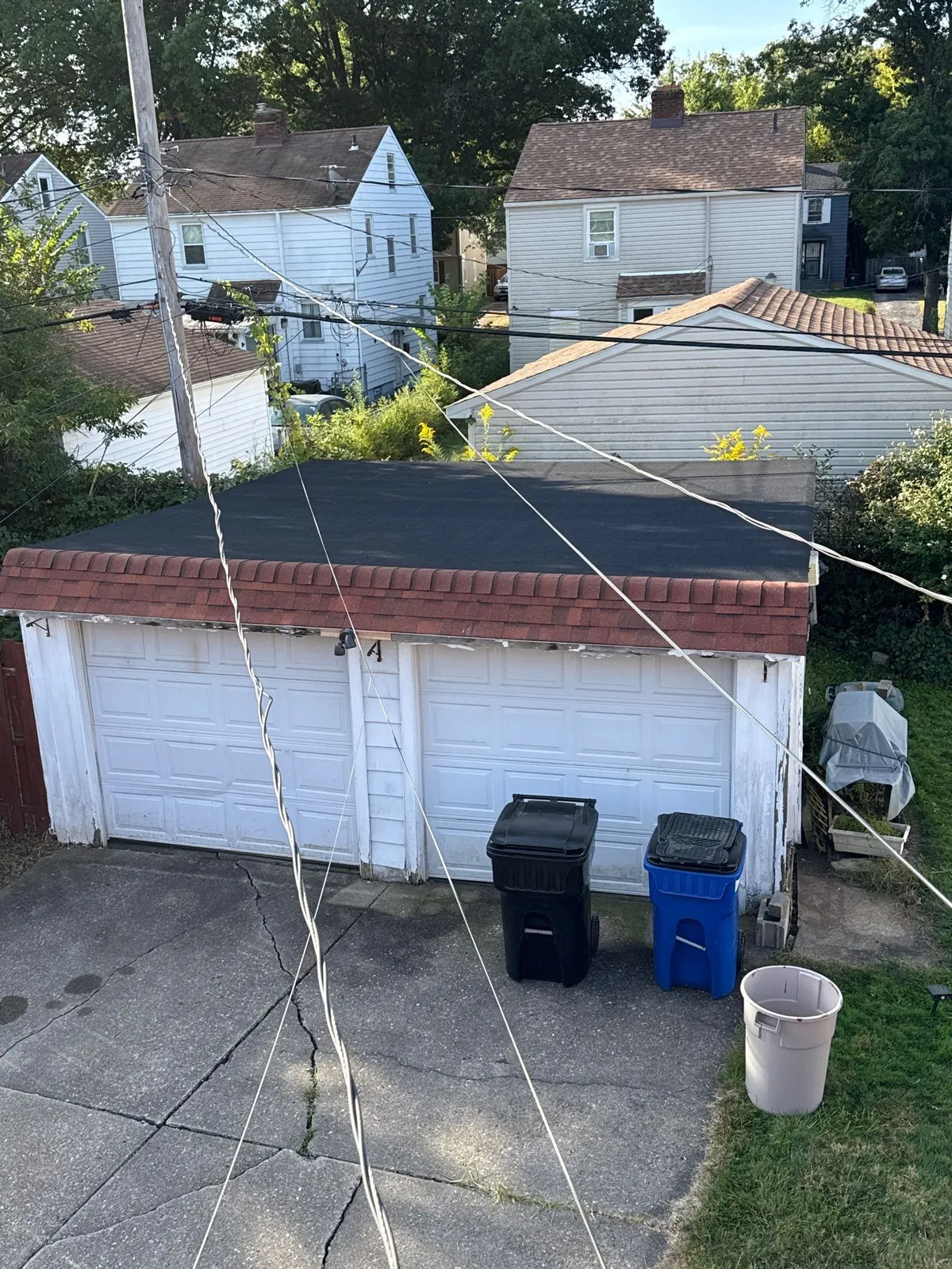 New flat roof on a detached two-car garage behind a Cleveland, Ohio home