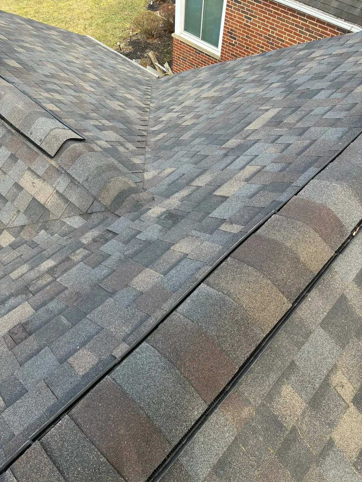 Close-up of a finished roof valley and ridge in new shingles on a home in Fairview Park, Ohio