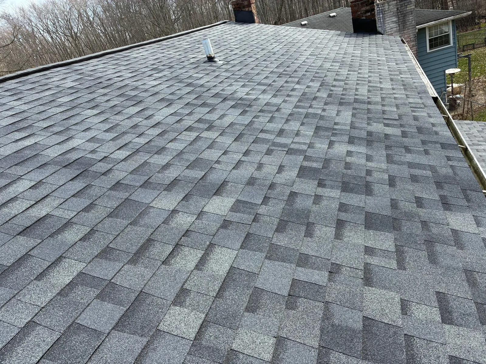 Close-up of gray architectural shingles on the roof of a North Olmsted, Ohio home