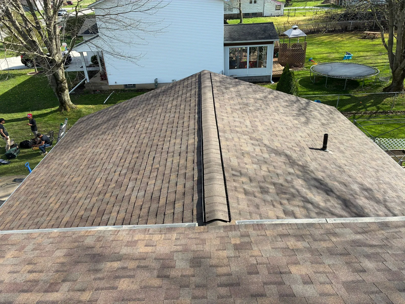 Aerial view of a new Owens Corning Duration Teak shingle roof and ridge on a home in North Ridgeville, Ohio
